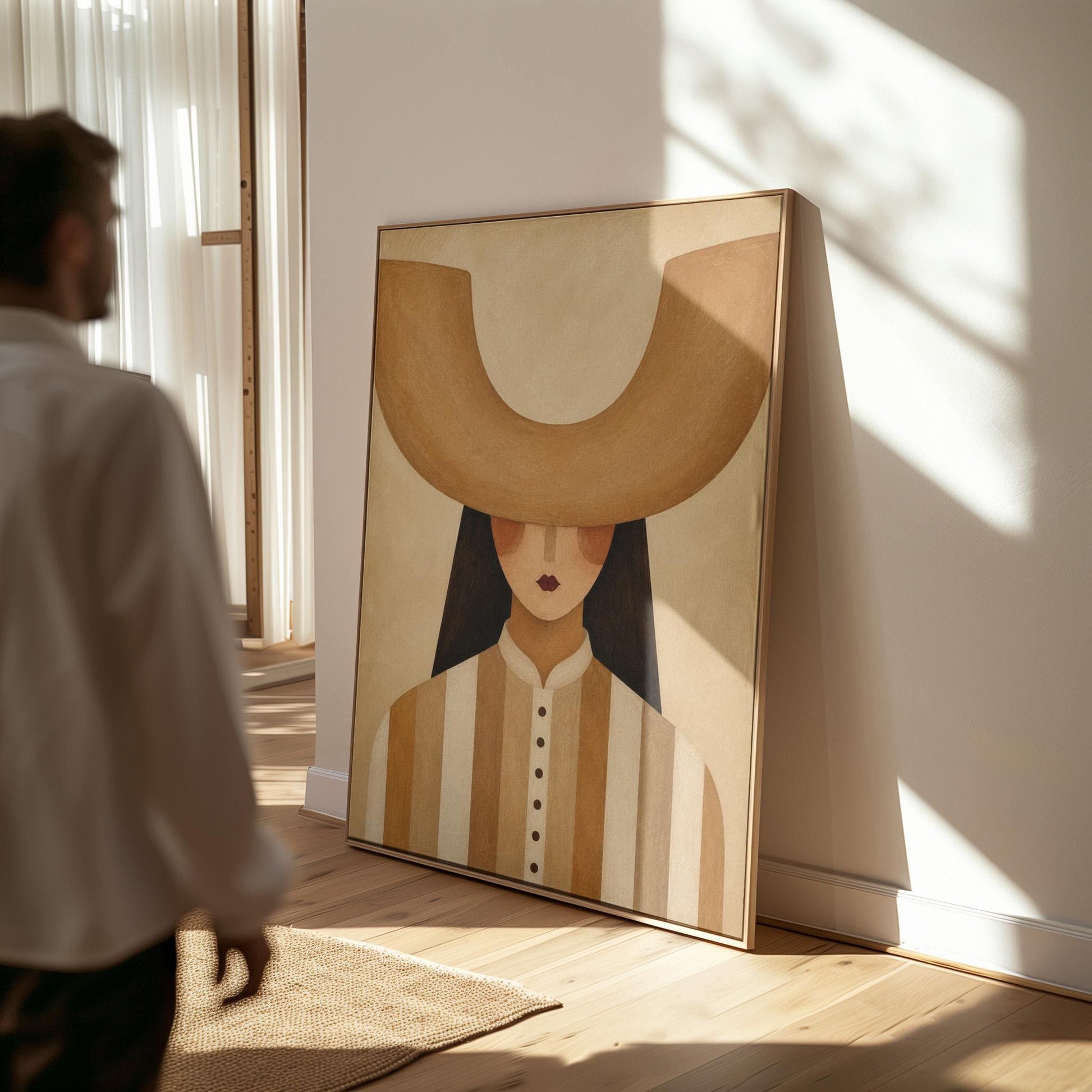 Faceless cowgirl under an enormous curved tan cowboy hat brim shape, canvas wall art hanging in a calm, modern living space