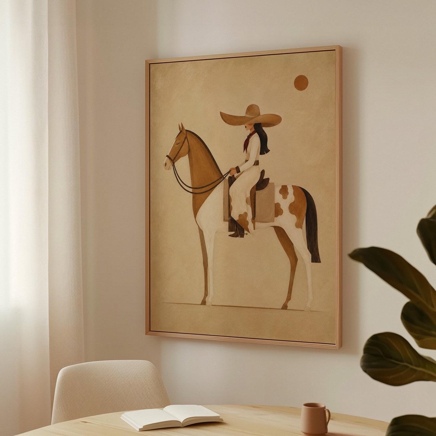 Cowgirl in a broad straw hat riding a cream and chestnut pinto horse, canvas wall art seen in a warm interior with natural light
