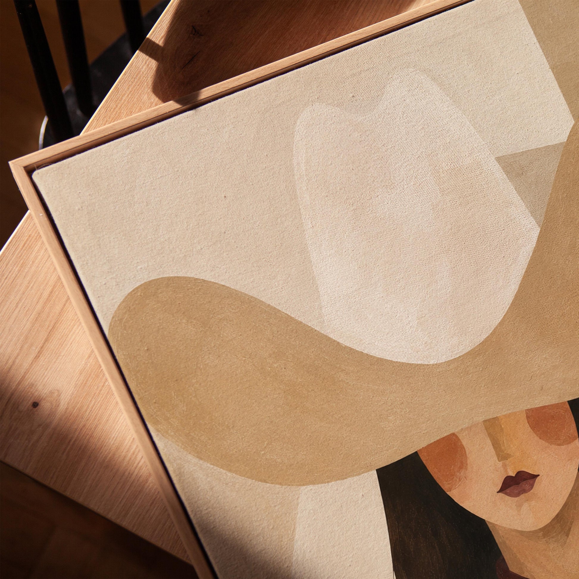 Close portrait of a cowgirl under a tan wide brim hat with a plum scarf, canvas print in a warm, minimally styled interior