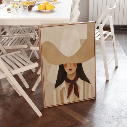 Close portrait of a cowgirl under a tan wide brim hat with a plum scarf, canvas wall art seen in a warm interior with natural light