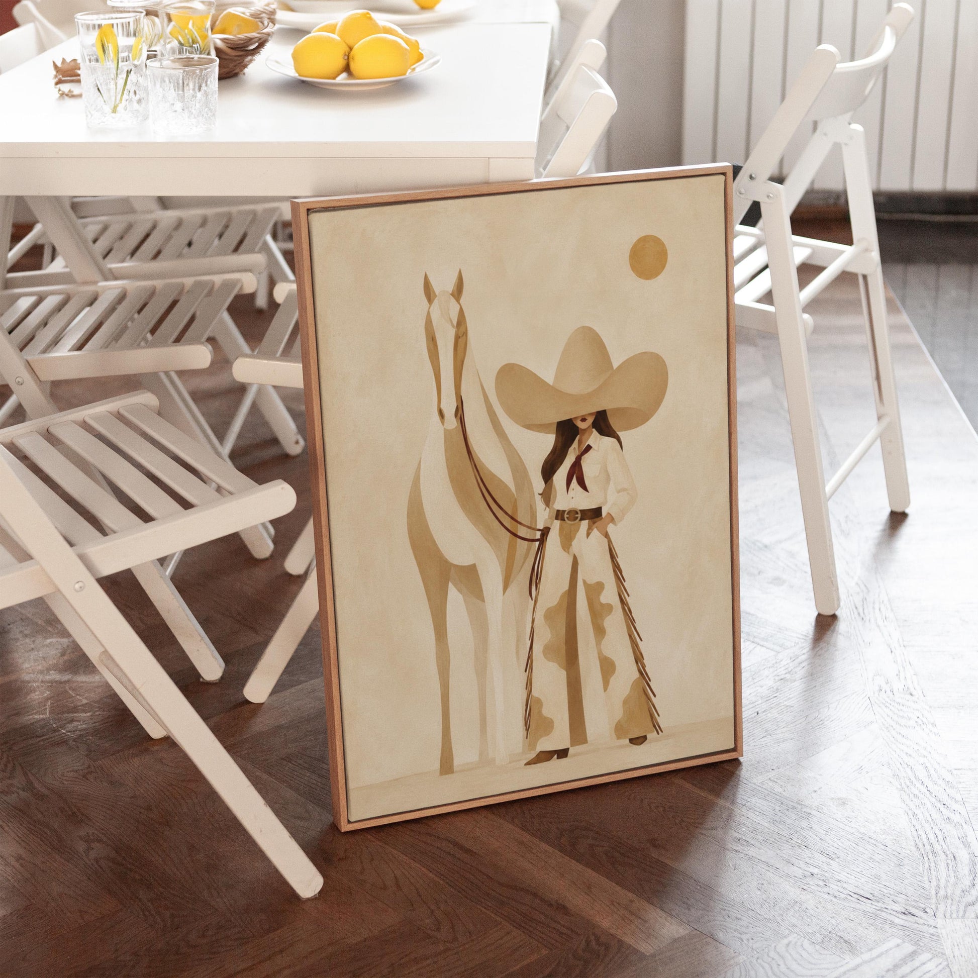 Cowgirl in cream chaps beside a pale horse under a small ochre sun, canvas wall art on a quiet wall in a considered interior