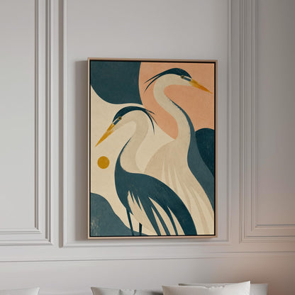 Two great herons with yellow beaks against a peach and teal sky, canvas print in a bright room with natural daylight