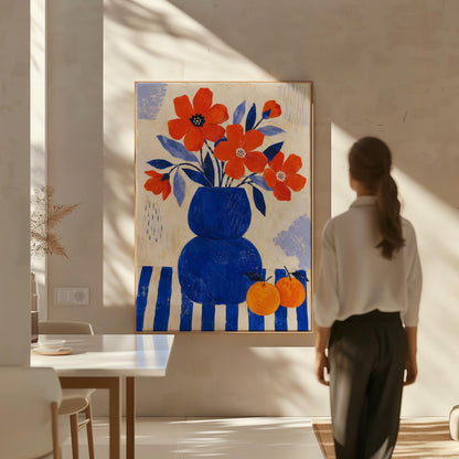 Scarlet poppies in a cobalt vase with oranges on a blue striped cloth, canvas wall art seen in a warm interior with natural light
