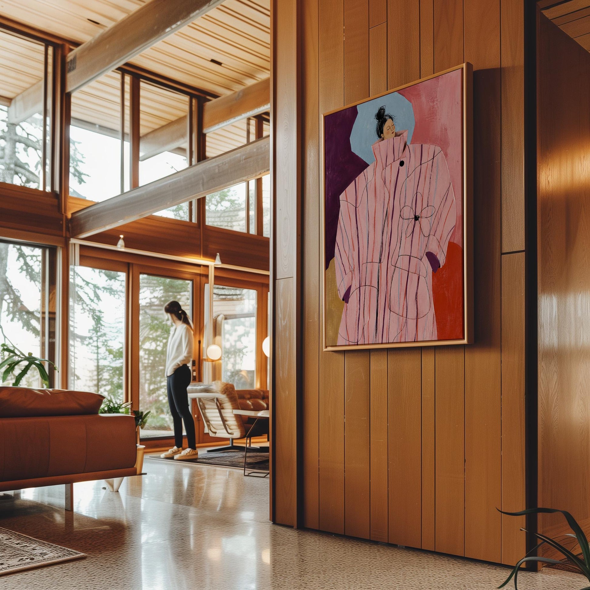 Woman in an oversized pink striped coat against plum and coral blocks, canvas wall art on a quiet wall in a considered interior