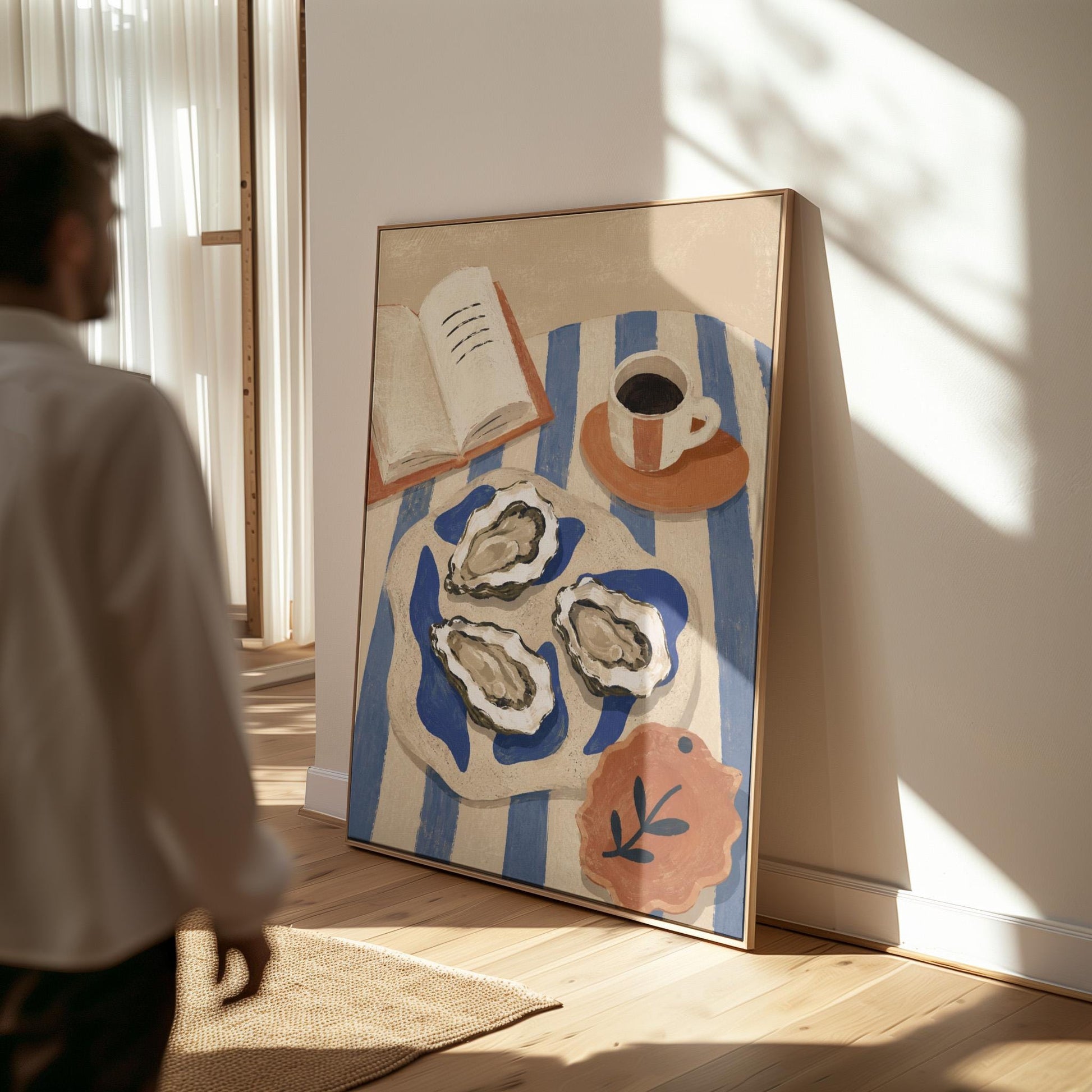 Plate of oysters with espresso and an open book on a striped cloth, canvas print hanging in a calm, modern living space