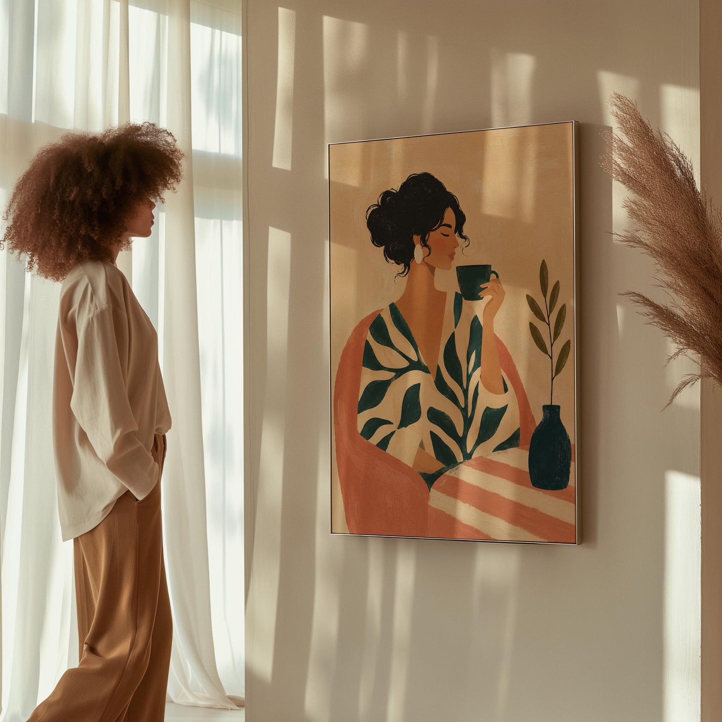 Woman in a leaf print robe drinking from a teal cup beside a vase, canvas print displayed on a neutral wall in a styled interior