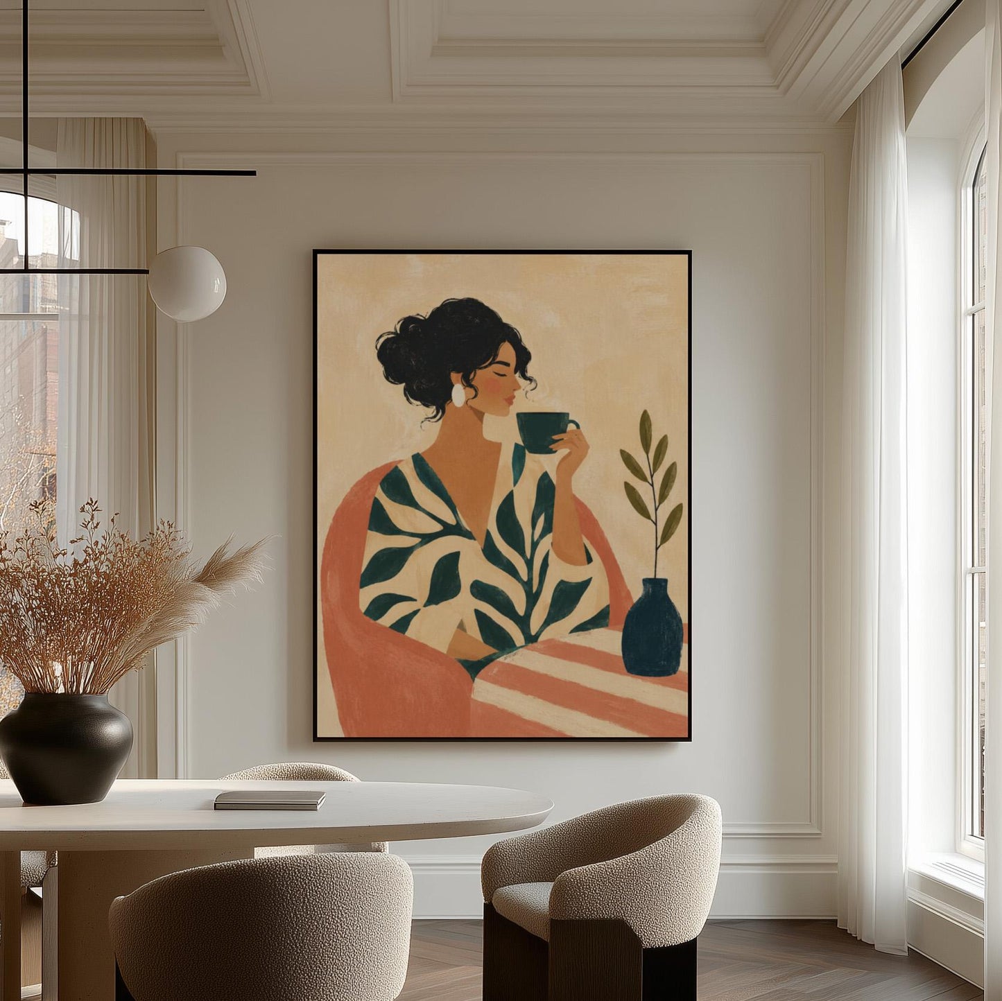 Woman in a leaf print robe drinking from a teal cup beside a vase, canvas wall art on a quiet wall in a considered interior