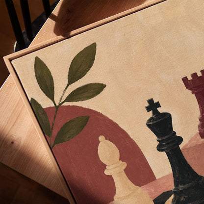 Chess pieces on a tilted board with an olive sprig and a red arch, canvas print in a warm, minimally styled interior