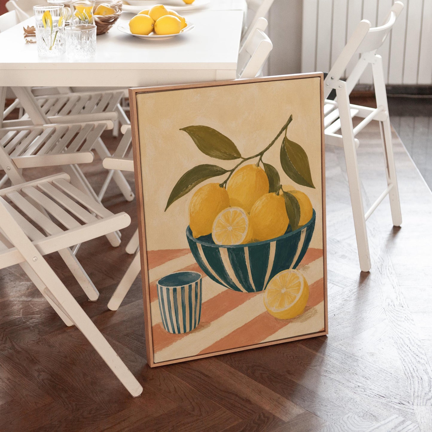 Lemons on the branch in a teal striped bowl on a pink striped cloth, canvas print displayed on a neutral wall in a styled interior