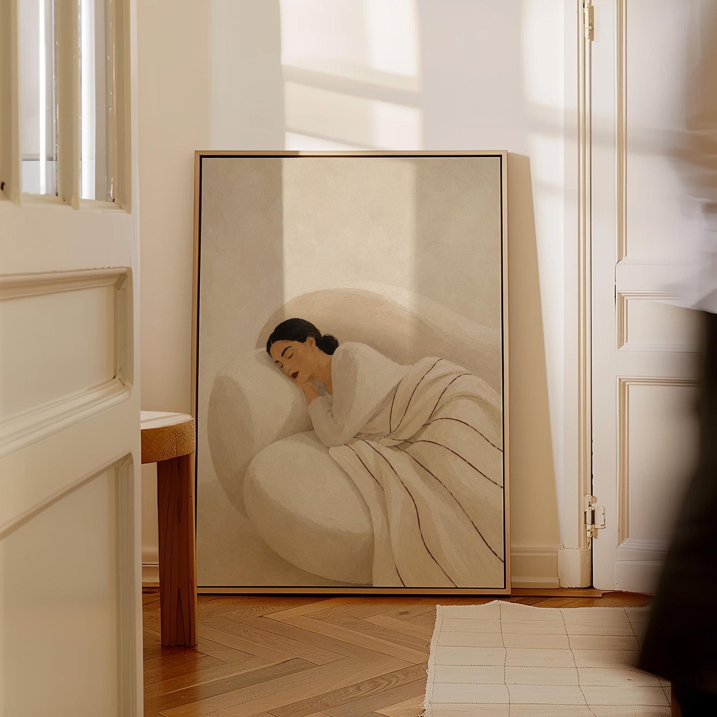 Woman sleeping under a white quilt threaded with fine burgundy lines, canvas print on a quiet wall in a considered interior