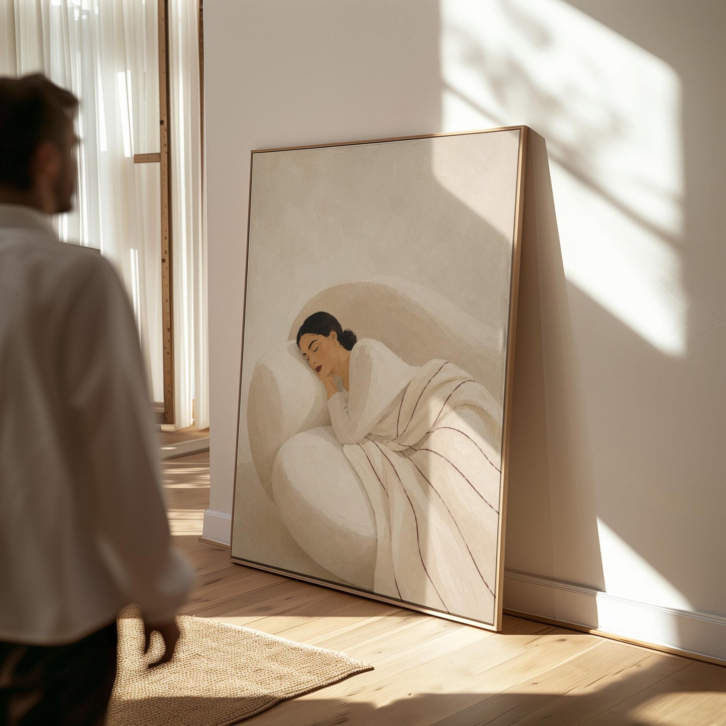 Woman sleeping under a white quilt threaded with fine burgundy lines, canvas print shown to scale in a furnished room