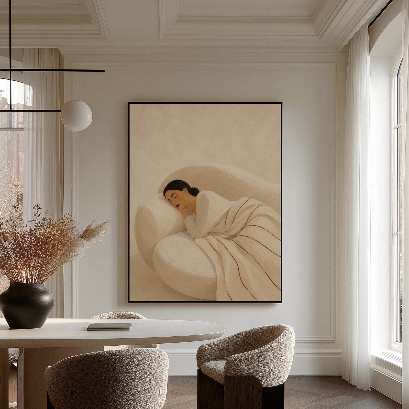 Woman sleeping under a white quilt threaded with fine burgundy lines, canvas wall art hanging in a calm, modern living space