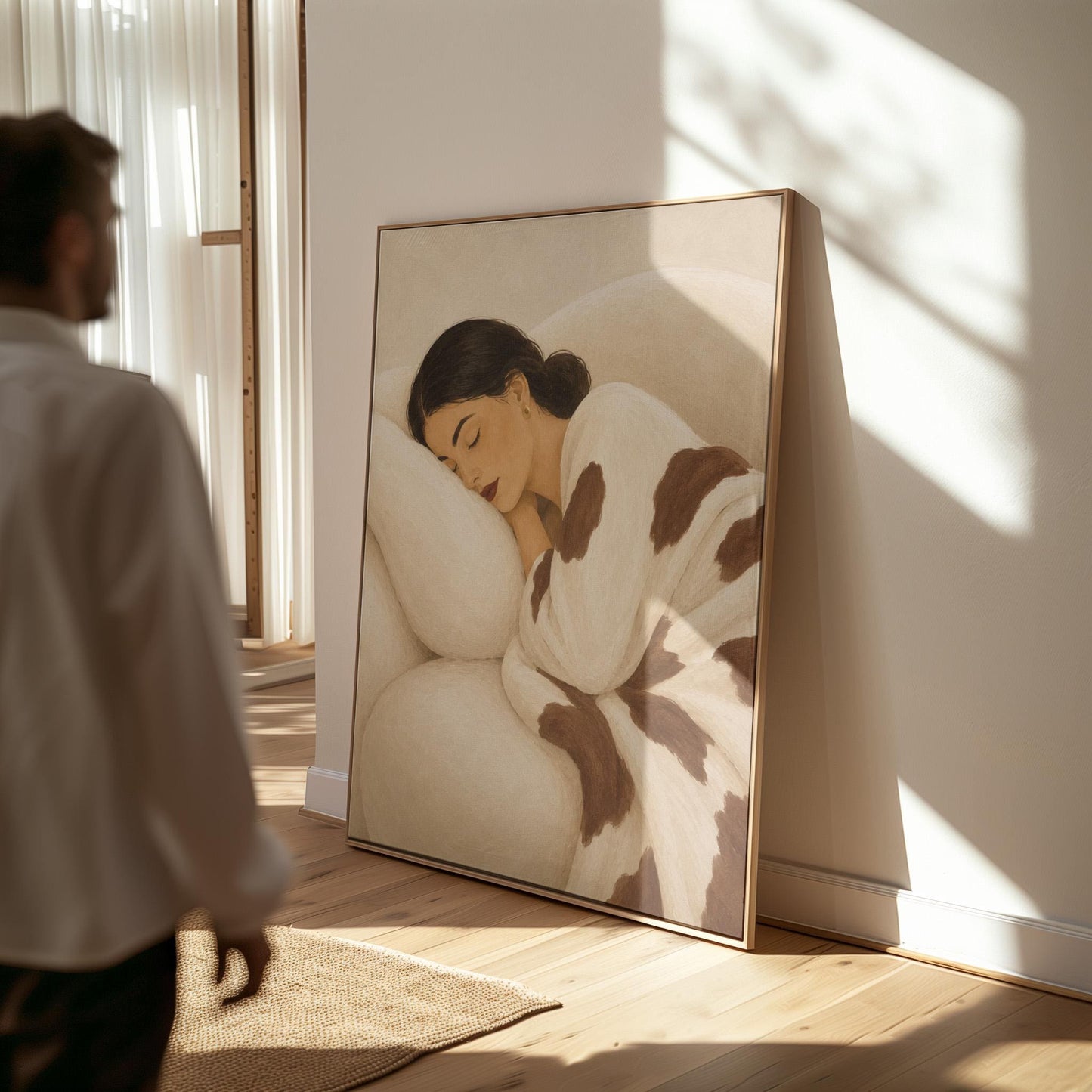 Woman asleep on a pillow under a cream blanket with brown markings, canvas print hanging in a calm, modern living space