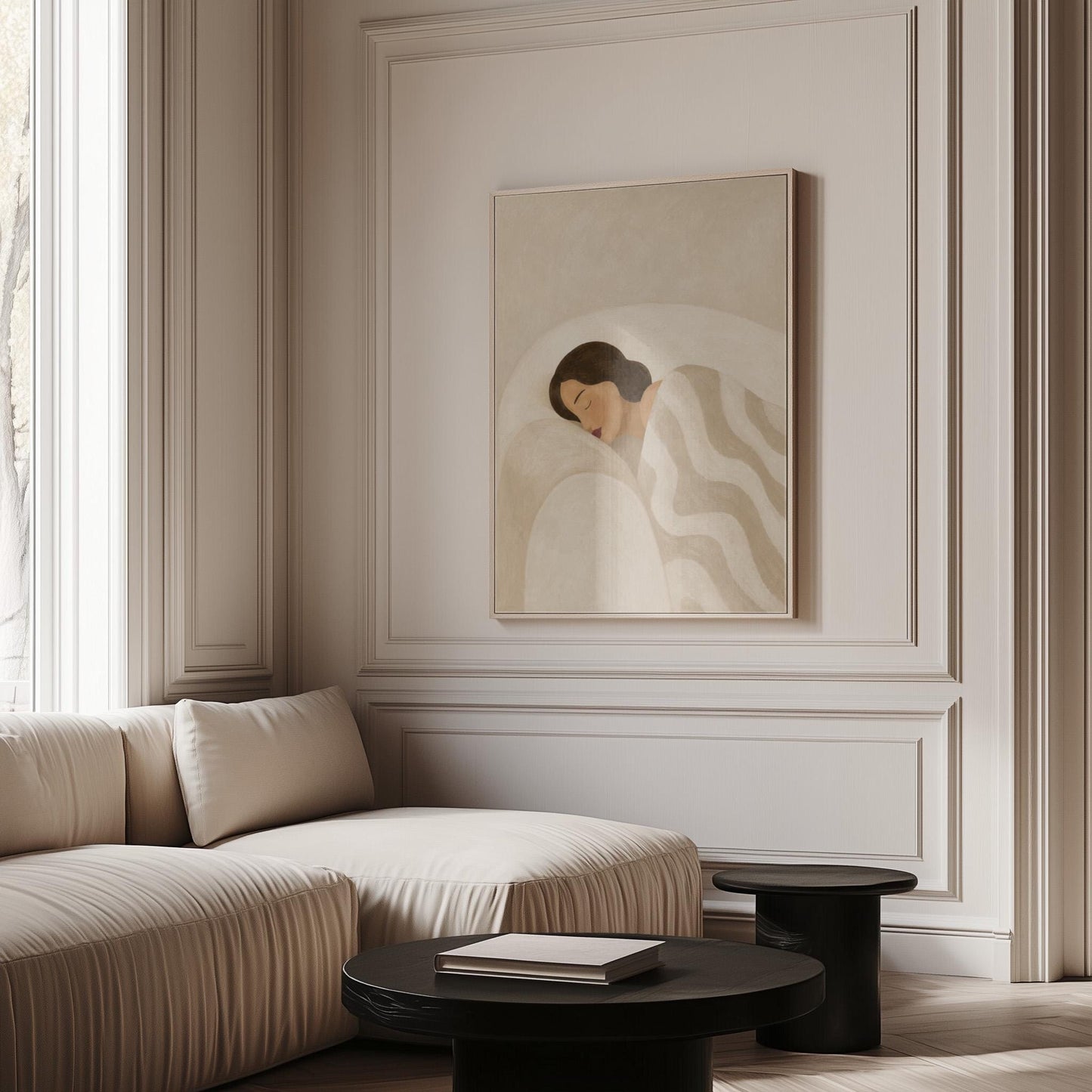 Woman asleep beneath a quilt of rolling cream and sand wave shapes, canvas print hanging in a calm, modern living space