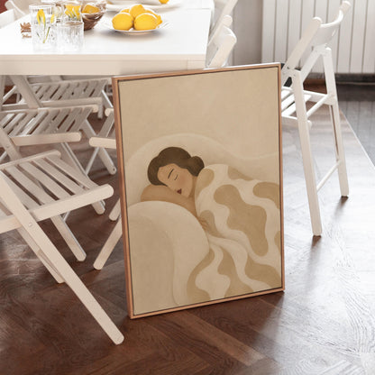 Woman sleeping under a cream blanket with soft camel cloud shapes, canvas print seen in a warm interior with natural light