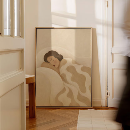 Woman sleeping under a cream blanket with soft camel cloud shapes, canvas wall art hanging in a calm, modern living space