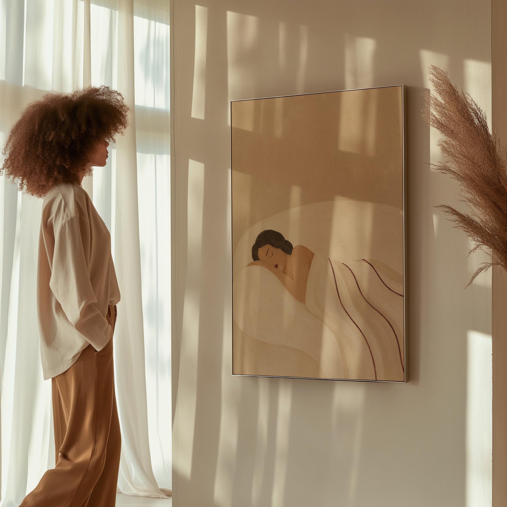 Woman asleep on her side under white linen with thin maroon lines, canvas wall art on a quiet wall in a considered interior