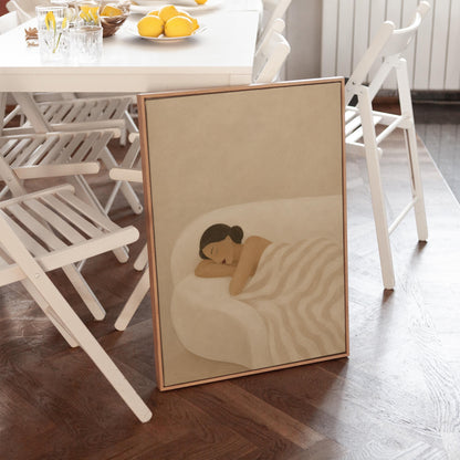 Woman sleeping with hands under her cheek beneath a soft striped quilt, canvas print on a quiet wall in a considered interior