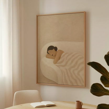 Woman sleeping with hands under her cheek beneath a soft striped quilt, canvas wall art hanging in a calm, modern living space