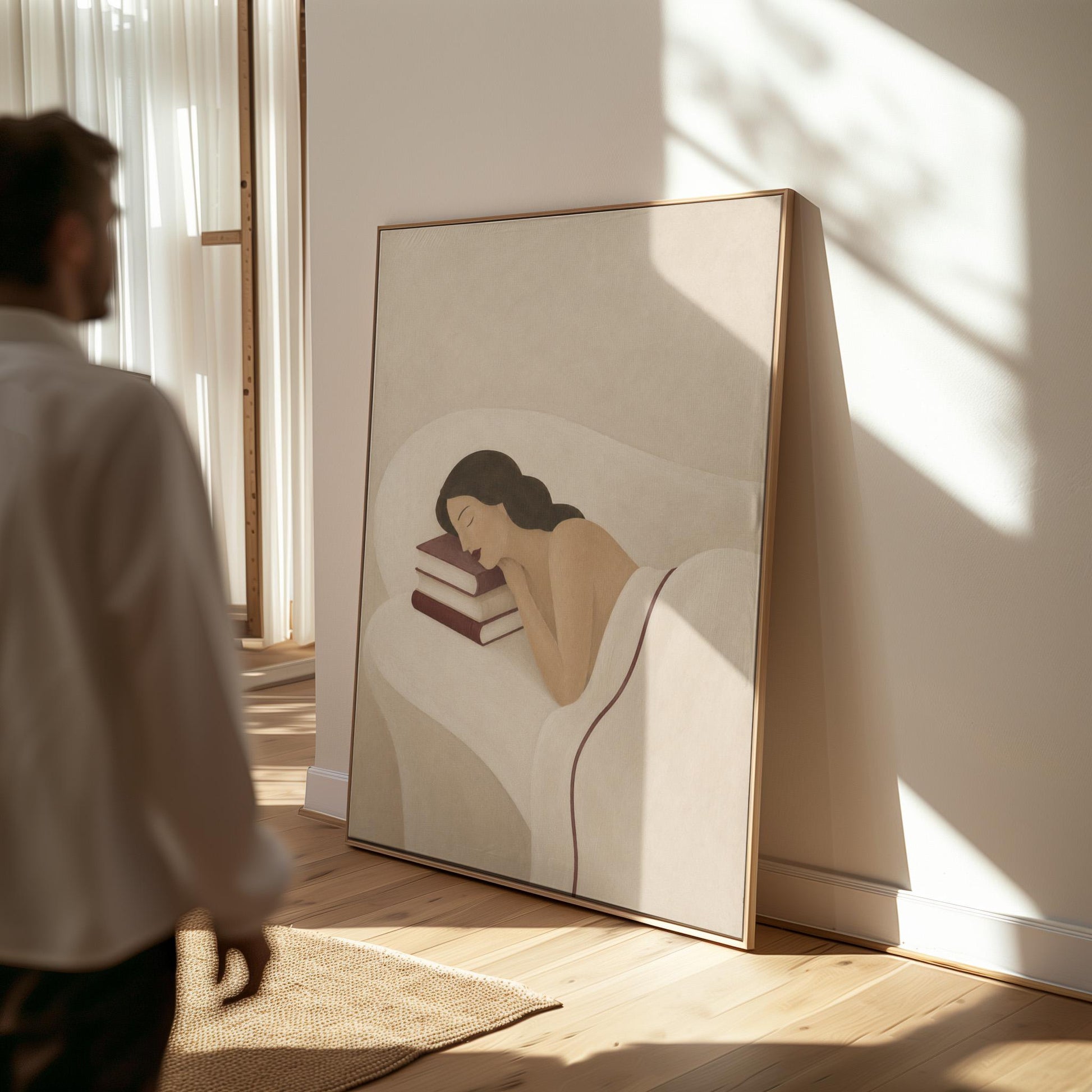 Woman resting her cheek on a stack of cream and burgundy books, canvas wall art seen in a warm interior with natural light