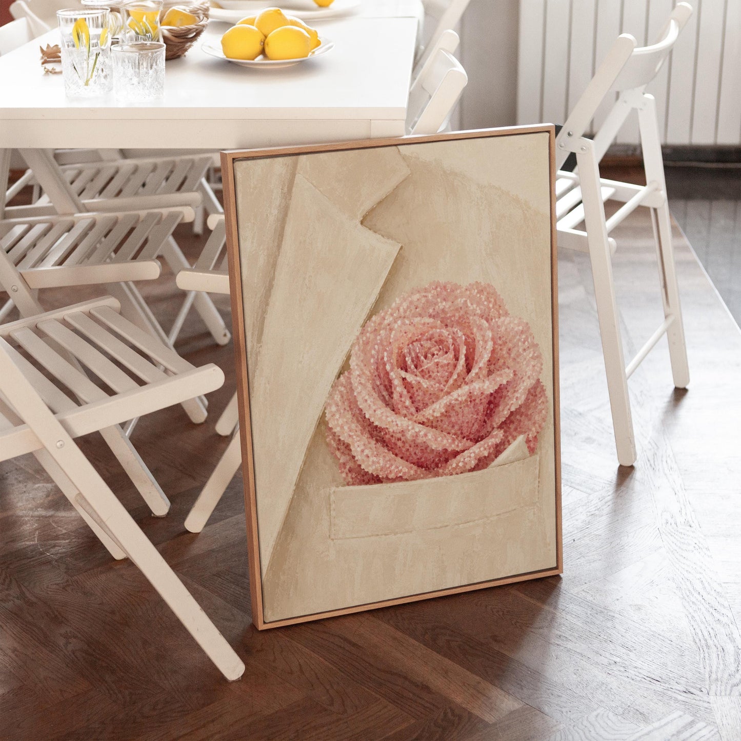 Blush pink rose with pearl beaded petals tucked into a cream pocket, canvas wall art hanging in a calm, modern living space