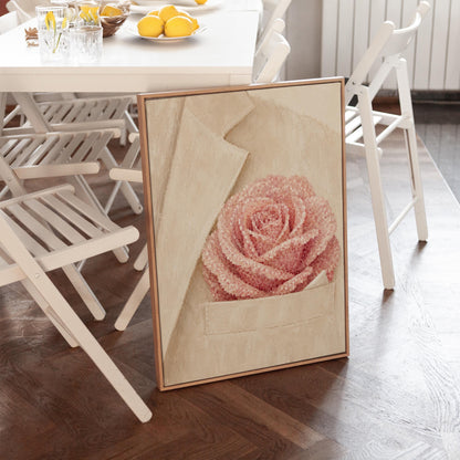 Blush pink rose with pearl beaded petals tucked into a cream pocket, canvas wall art hanging in a calm, modern living space