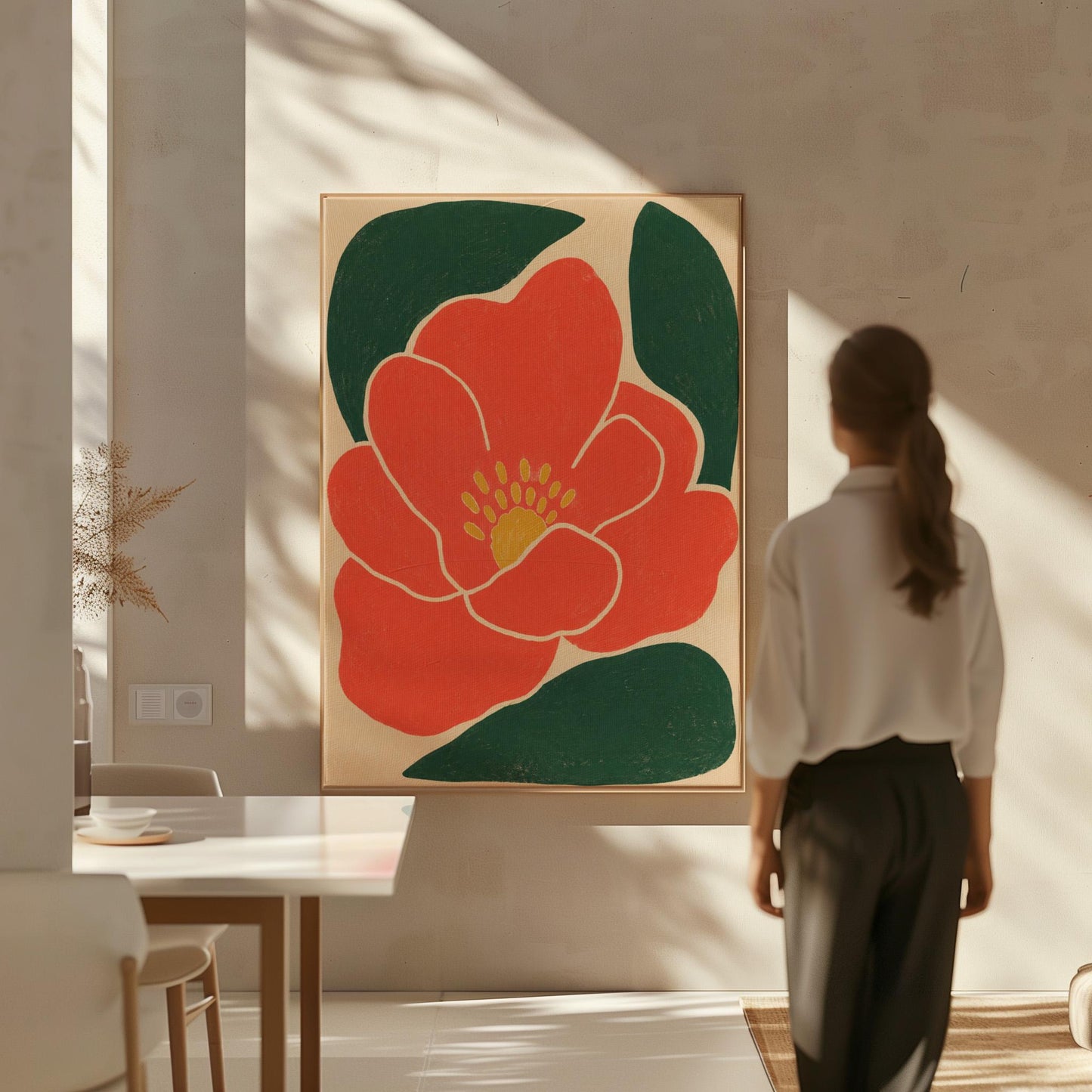 Scarlet flower with gold stamens over deep green leaves on sand, canvas print hanging in a calm, modern living space