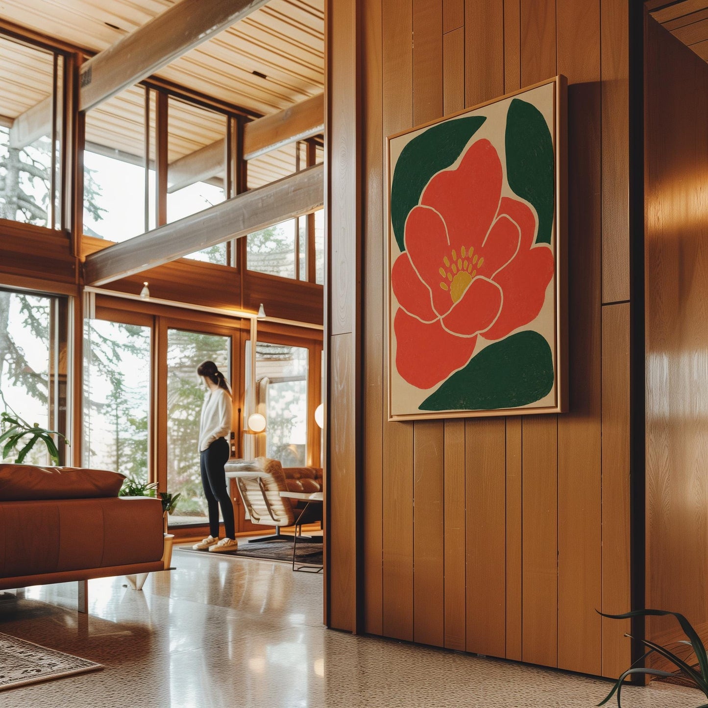 Scarlet flower with gold stamens over deep green leaves on sand, canvas print seen in a warm interior with natural light