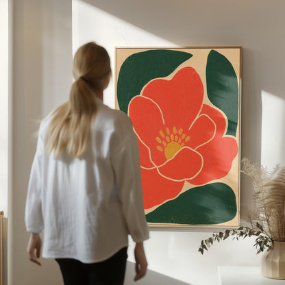 Scarlet flower with gold stamens over deep green leaves on sand, canvas wall art hanging in a calm, modern living space