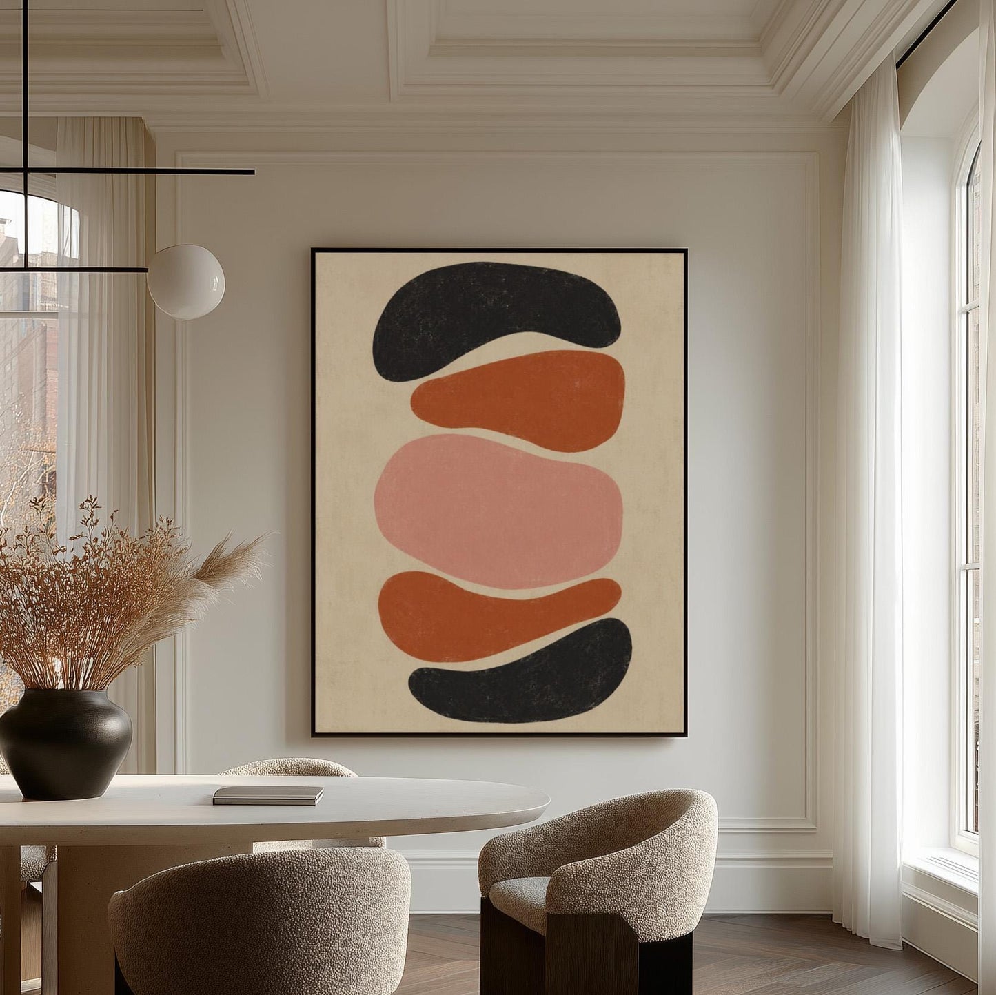 Five stacked pebble shapes in charcoal rust and blush on cream, canvas print on a quiet wall in a considered interior