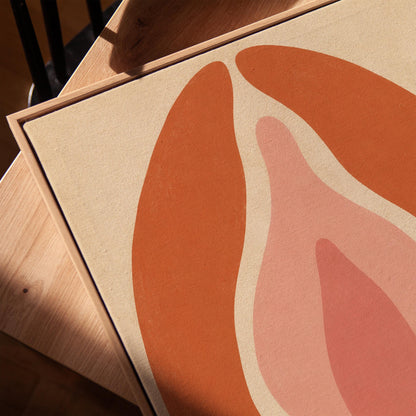 Tall terracotta oval enclosing soft layers of blush and pale rose, canvas print in a warm, minimally styled interior