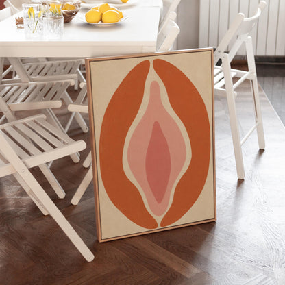 Tall terracotta oval enclosing soft layers of blush and pale rose, canvas print shown in a sunlit, contemporary room