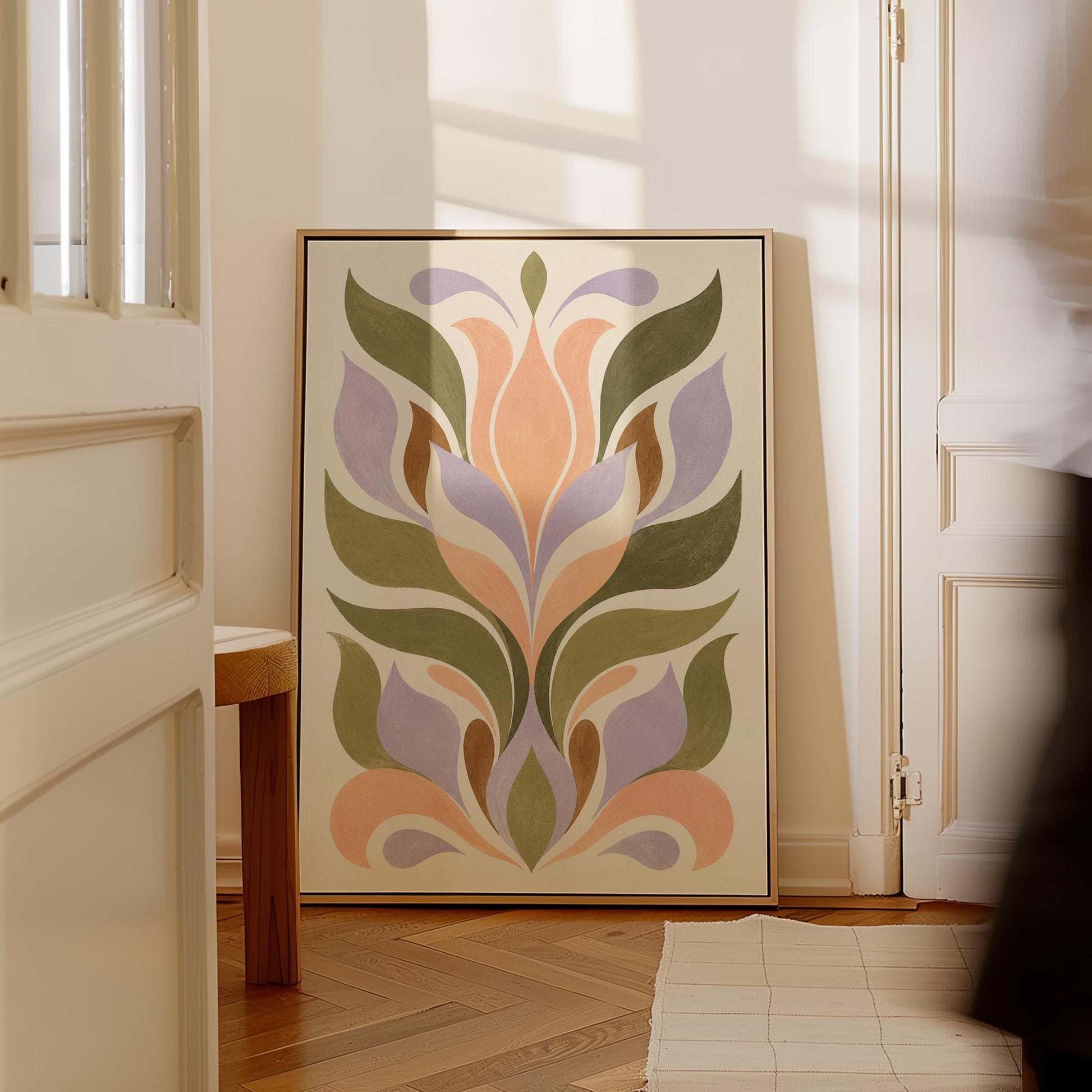 Symmetrical folk tulip motif in olive lilac and peach on cream, canvas wall art on a quiet wall in a considered interior