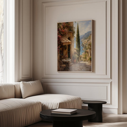 Italian village cafe painting with striped awning and coastal view, canvas print hanging in a calm, modern living space
