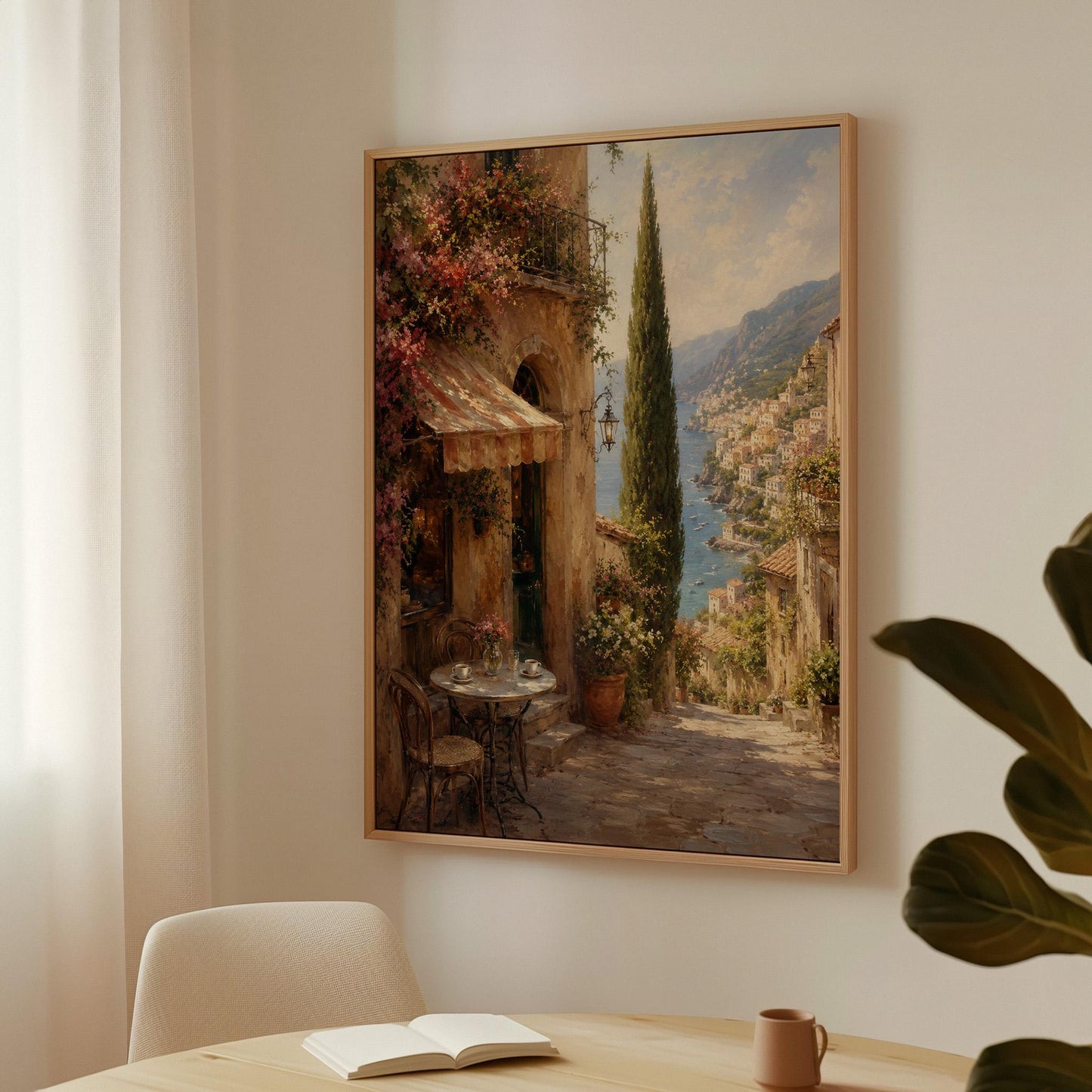 Italian village cafe painting with striped awning and coastal view, canvas wall art seen in a warm interior with natural light