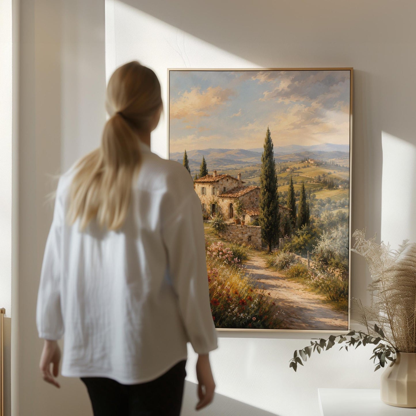 Tuscan farmhouse landscape with cypresses and poppies, canvas print seen in a warm interior with natural light