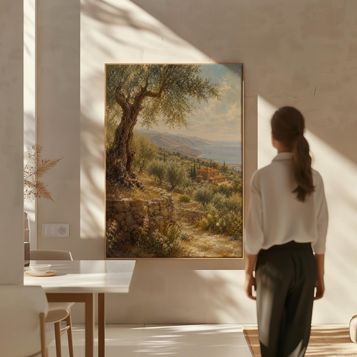 Old olive tree over a Mediterranean coastline, canvas print displayed on a neutral wall in a styled interior