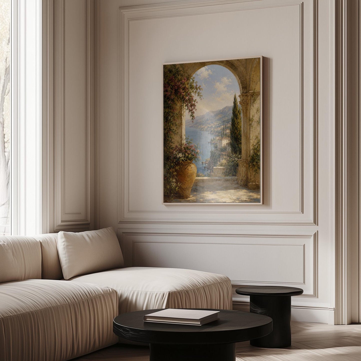 Mediterranean coastline seen through an old stone arch, canvas print shown to scale in a furnished room