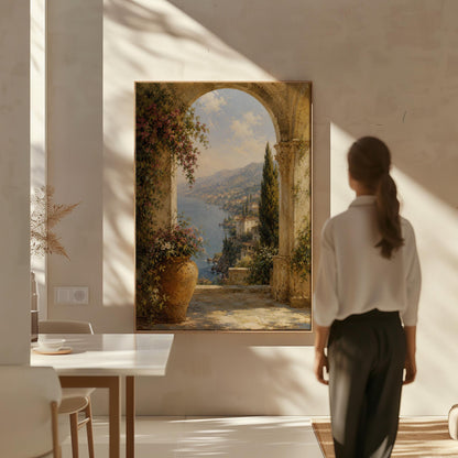 Mediterranean coastline seen through an old stone arch, canvas print displayed on a neutral wall in a styled interior