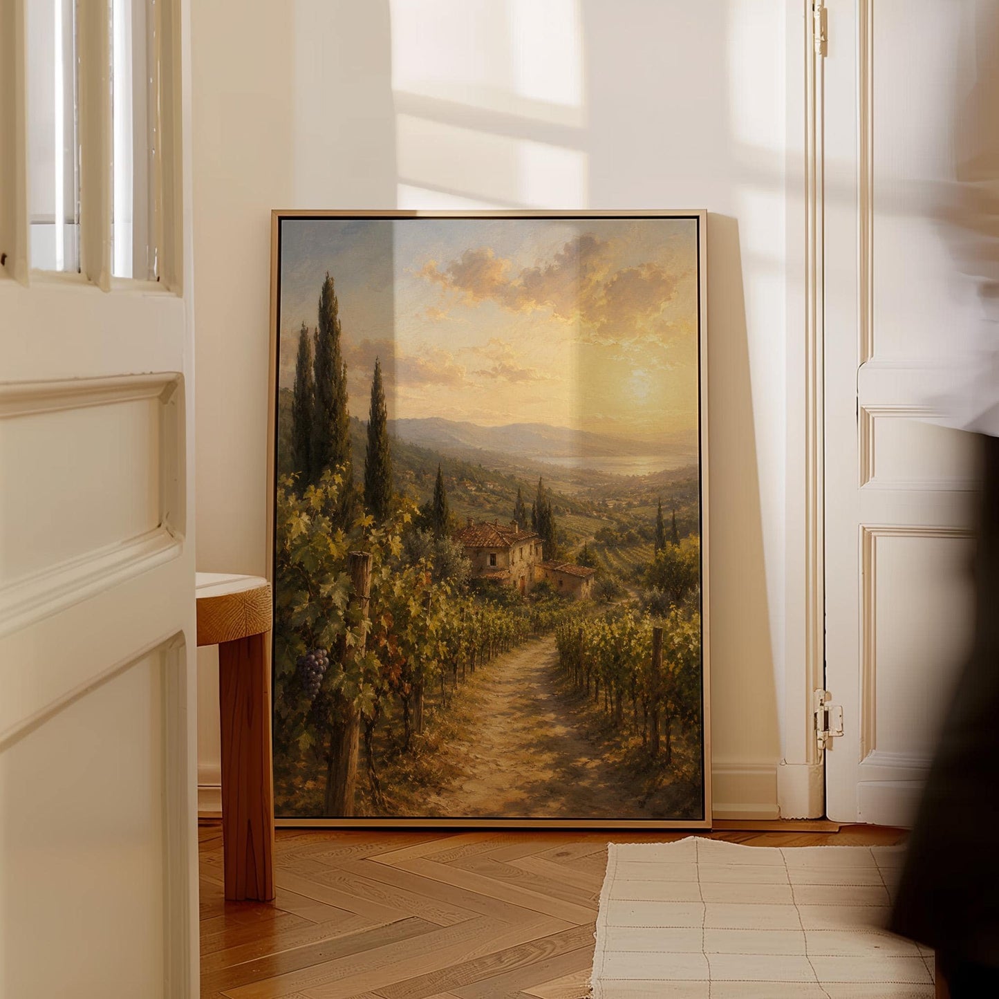 Tuscan vineyard at sunset with a stone farmhouse, canvas print seen in a warm interior with natural light