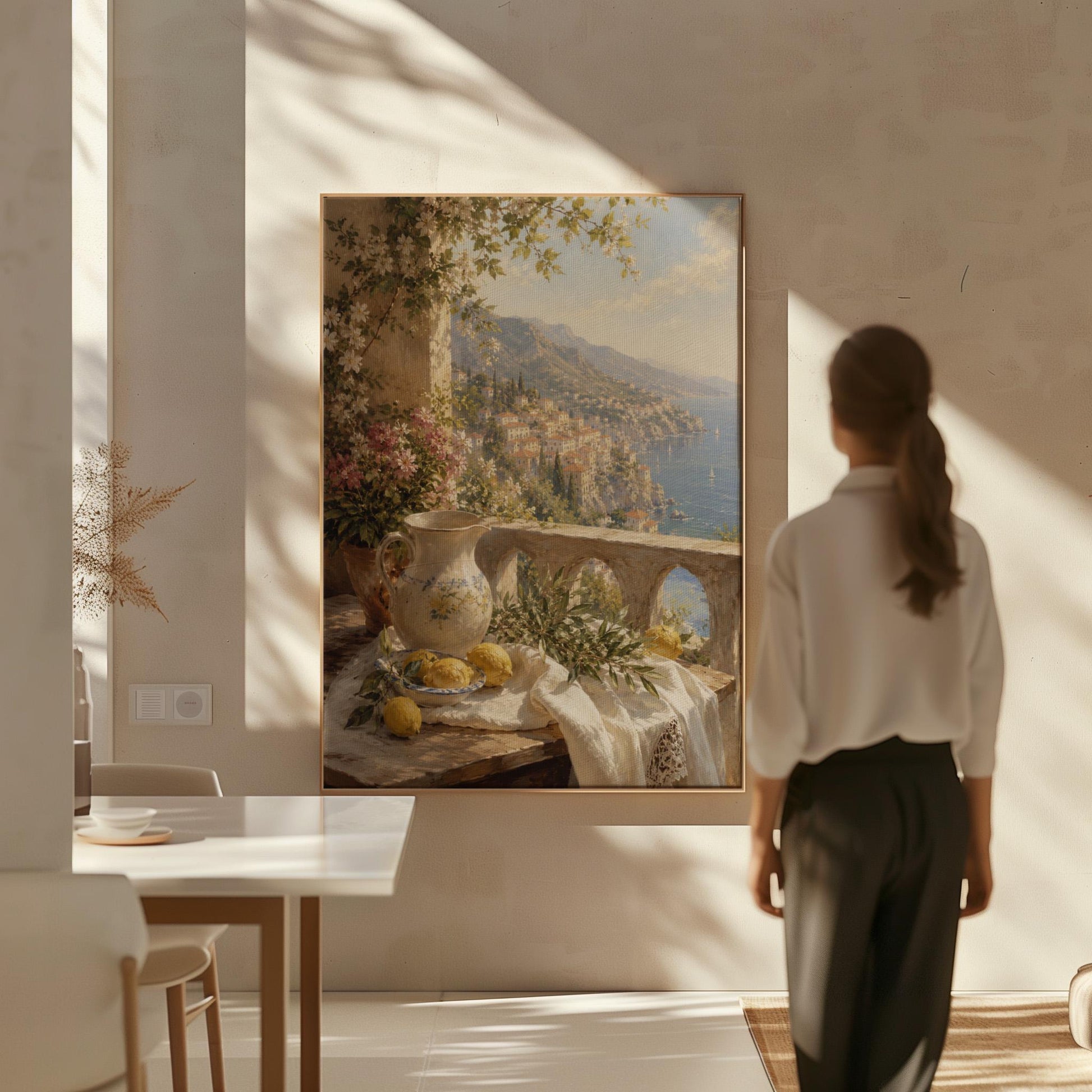 Lemon still life with a ceramic pitcher on an Italian balcony, canvas print presented in a light, minimal room