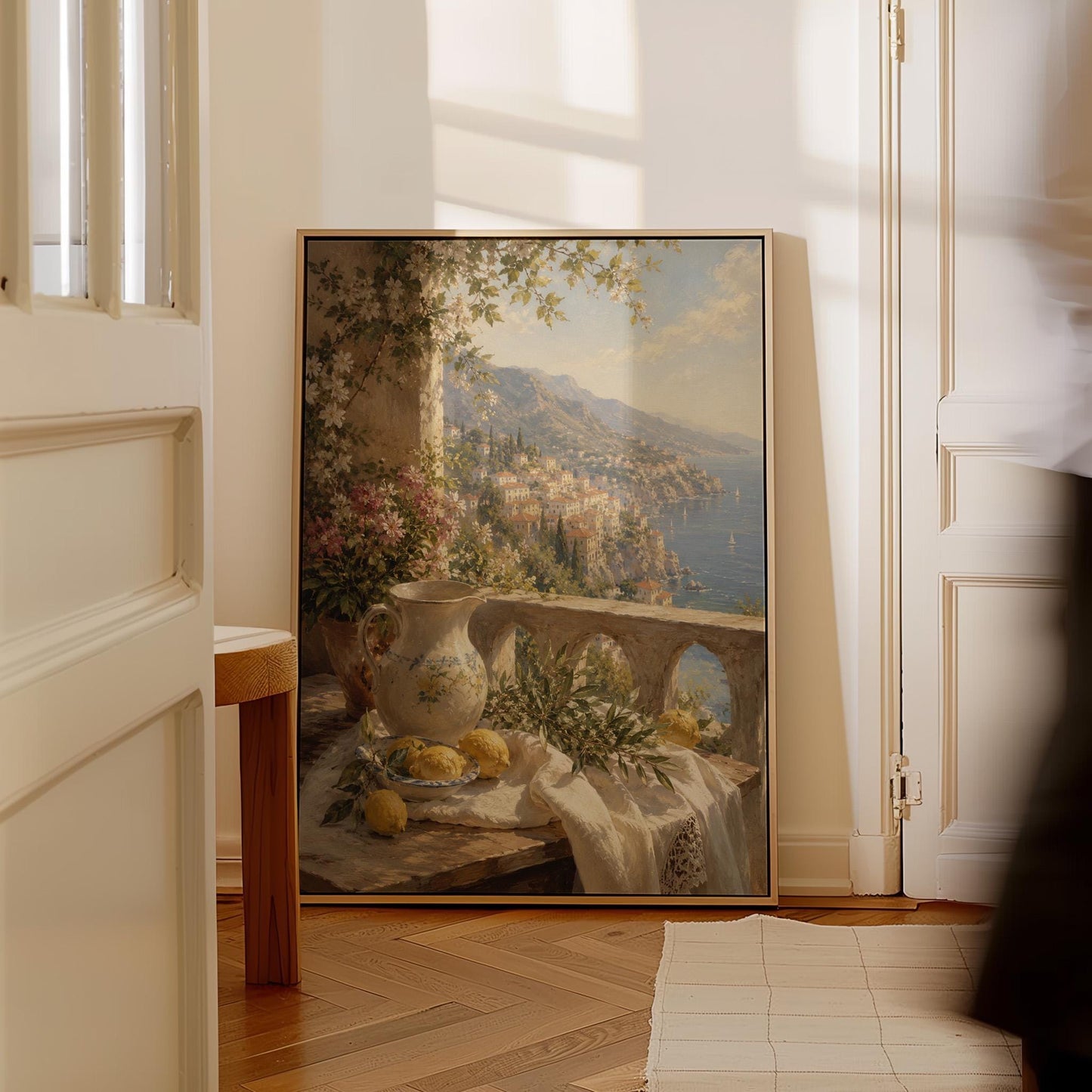 Lemon still life with a ceramic pitcher on an Italian balcony, canvas print displayed on a neutral wall in a styled interior