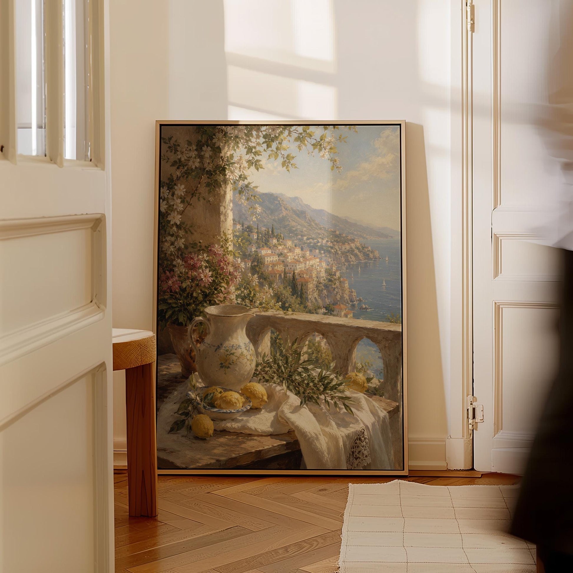 Lemon still life with a ceramic pitcher on an Italian balcony, canvas print displayed on a neutral wall in a styled interior