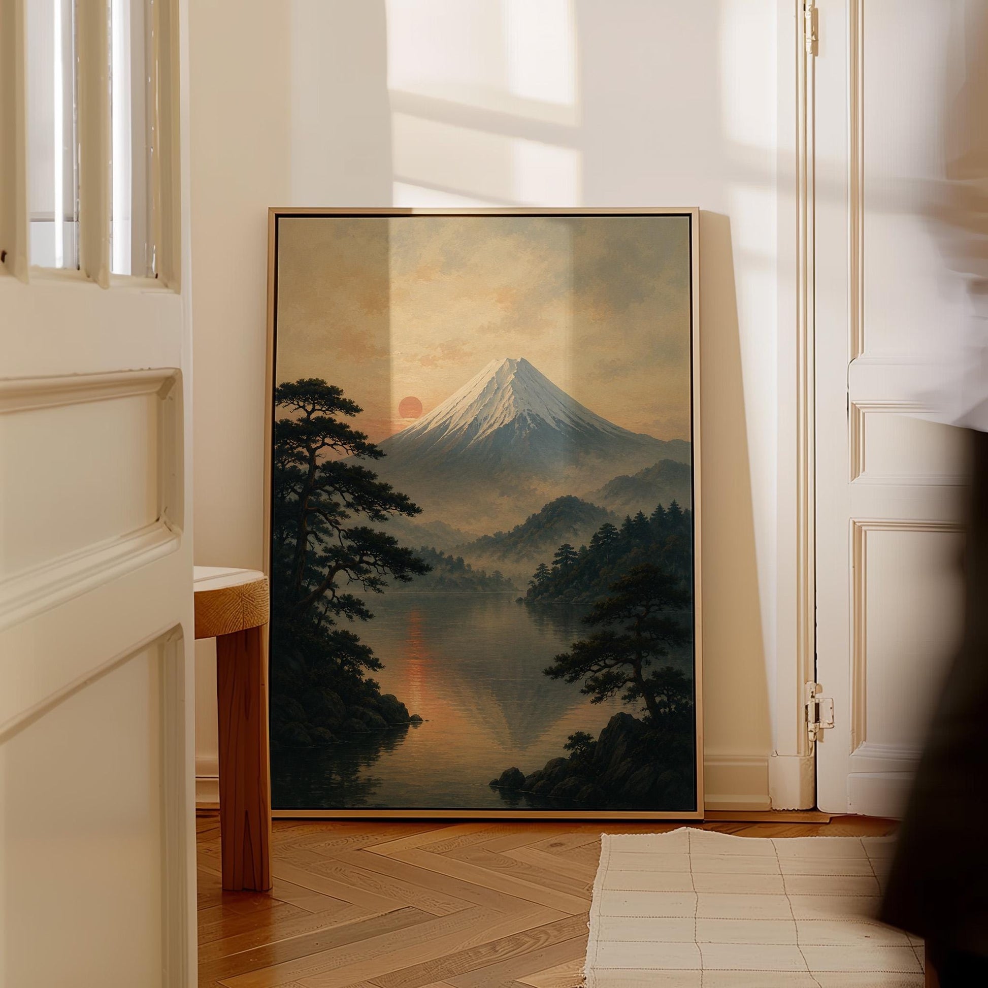 Snow-capped Mount Fuji at sunrise over a still lake, canvas print shown to scale in a furnished room