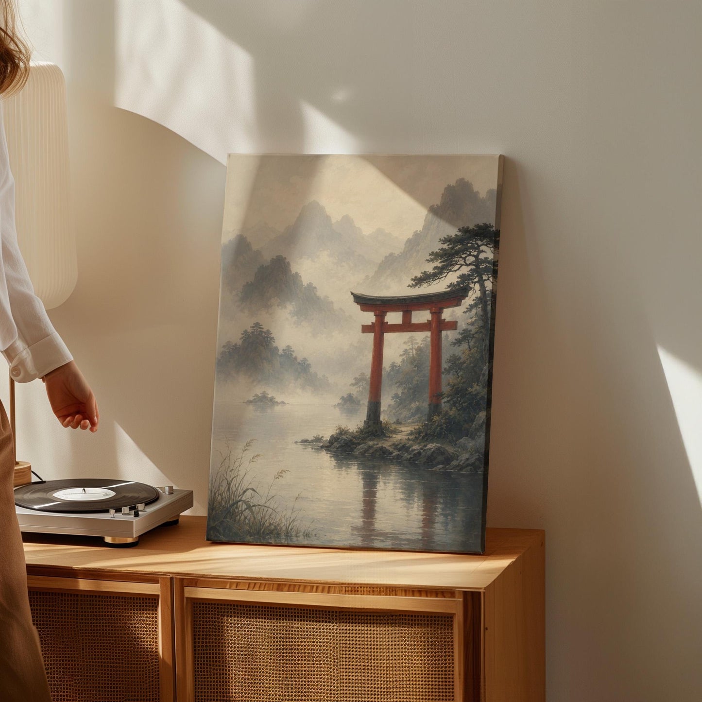 Red torii gate at the edge of a misty lake, canvas print hanging in a calm, modern living space