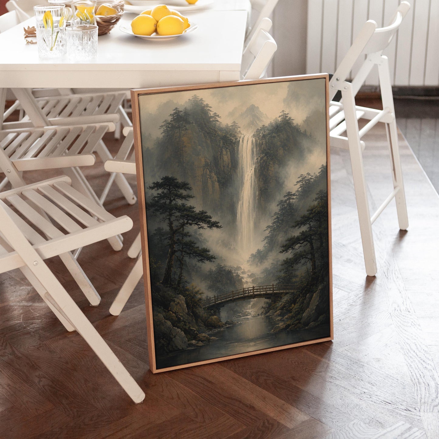 Tall waterfall and wooden bridge in a misty gorge, canvas print displayed on a neutral wall in a styled interior