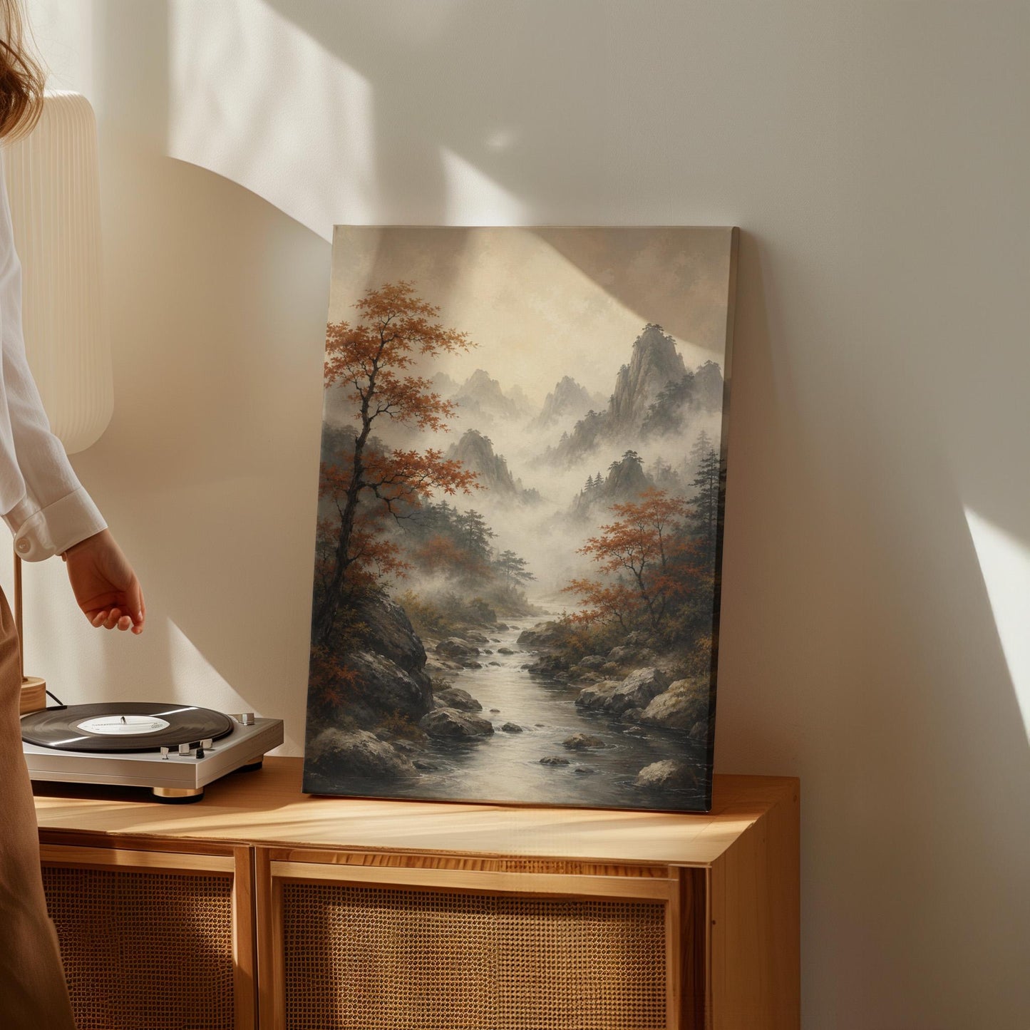 Autumn maples along a misty mountain stream, canvas print hanging in a calm, modern living space