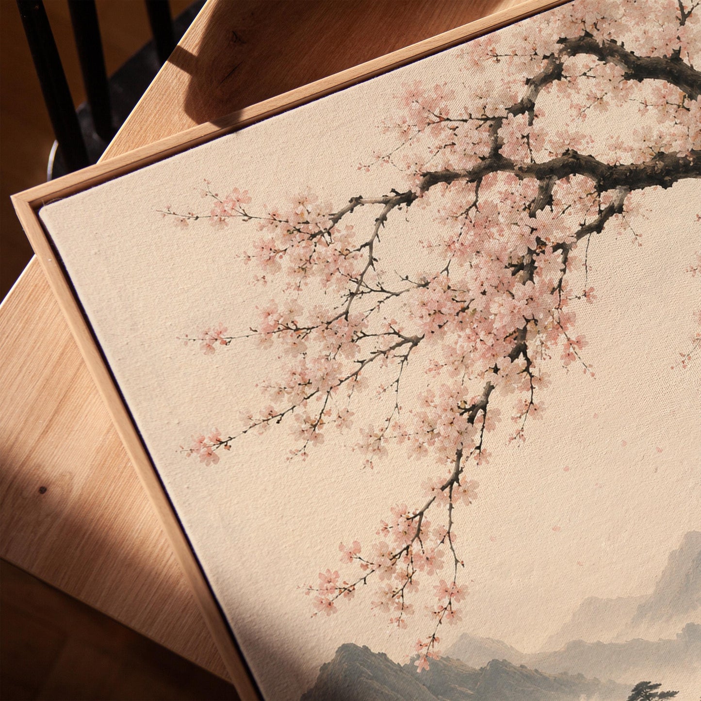 Cherry blossom branches over a misty mountain lake, canvas print in a warm, minimally styled interior