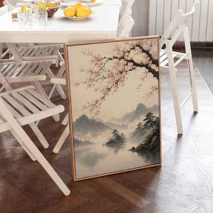 Cherry blossom branches over a misty mountain lake, canvas print presented in a light, minimal room