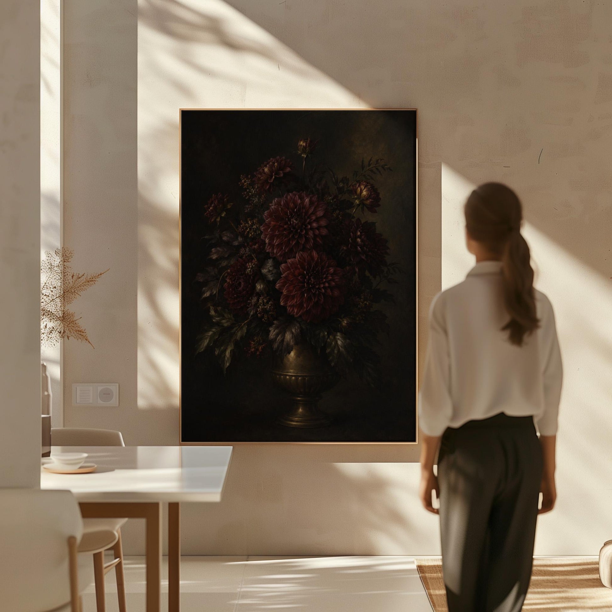 Burgundy dahlias in a brass urn against darkness, canvas print shown to scale in a furnished room